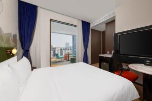 Cama o camas de una habitación en Hampton by Hilton Shenzhen Nanshan Science and Technology Park