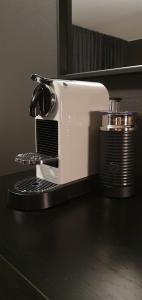 a white toaster sitting on top of a counter at Hotell Iföhus in Bromölla