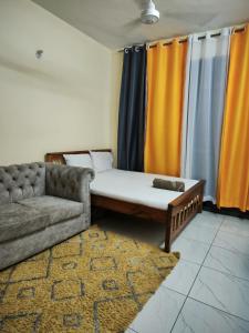 Un ou plusieurs lits dans un hébergement de l'établissement Mudzini Home