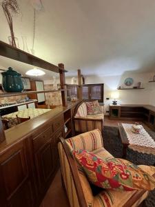 a living room with some chairs and a table at Casa vacanze Monte in Castellino Tanaro