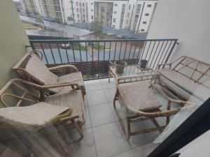 a balcony with two chairs and a table on a balcony at Quiet 3 bed all to yourself in Avalon