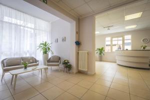 Posezení v ubytování Hotel La Perla