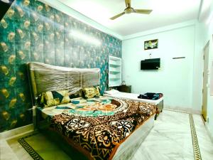 a bedroom with a large bed in a room at Trilok Residency - Dashashwamedh Varanasi in Varanasi