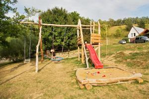 a playground with two swings and a swing at Vinný sklep Krýsa in Kostelec