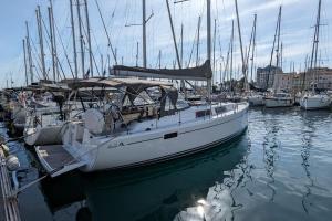 a white boat docked in a harbor with other boats at Idéal Lions - Dielli in Cannes