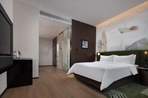 Cama o camas de una habitación en Hampton by Hilton Shenzhen Nanshan Science and Technology Park