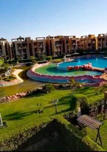 an aerial view of a resort with two swimming pools at بلو باي اسيا للعائلات فقط in Ain Sokhna