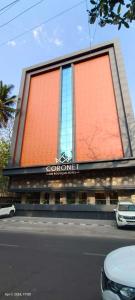 a building with a sign on the side of it at Coronet The Boutique Hotel in Pune