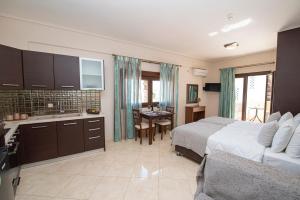 Μια τηλεόραση ή/και κέντρο ψυχαγωγίας στο Ostrella Hotel - Luxury rooms