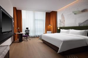 Cama o camas de una habitación en Hampton by Hilton Shenzhen Nanshan Science and Technology Park