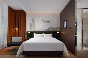 Cama o camas de una habitación en Hampton by Hilton Shenzhen Nanshan Science and Technology Park