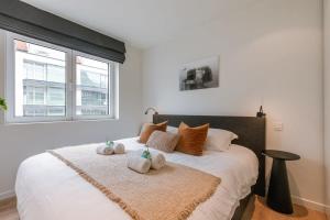 Llit o llits en una habitació de Stunning central apartment in the heart of Knokke