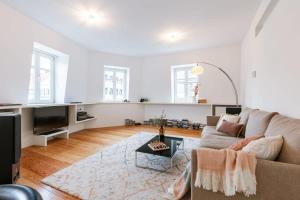 a living room with a couch and a table at Central 'The Crown' apartment in Ghent in Ghent