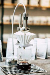 a coffee maker sitting on top of a table at WAY SWEET DREAMS - Room 3 in Ghent