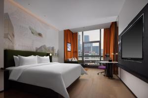 Cama o camas de una habitación en Hampton by Hilton Shenzhen Nanshan Science and Technology Park
