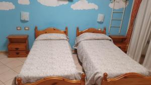 Postel nebo postele na pokoji v ubytování Hotel 4 Mori