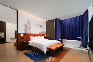Cama o camas de una habitación en Hampton by Hilton Shenzhen Nanshan Science and Technology Park
