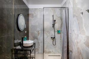 a bathroom with a shower and a sink at Hotel Forty One in Bucharest +27 photos