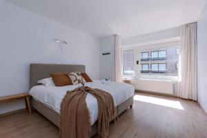 Ένα ή περισσότερα κρεβάτια σε δωμάτιο στο Huswell - Corner apartment with spectacular sea view