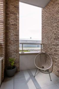 Balkón nebo terasa v ubytování Huswell - Modern apartment in a new residence near the sea