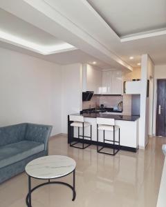 a living room with a couch and a table at Sophisticated apartment in Maputo