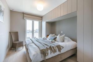 Postel nebo postele na pokoji v ubytování Huswell - Bright apartment with parking near the beach