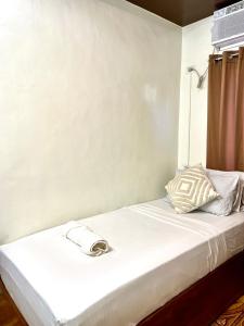Postel nebo postele na pokoji v ubytování Corazon El Nido Inn