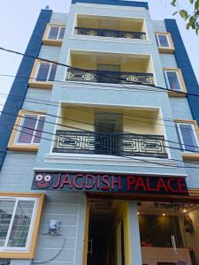 a building with a jacesthesia palace sign on it at Hotel Jagdish Palace Puri in Puri
