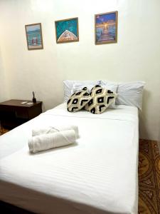 Postel nebo postele na pokoji v ubytování Corazon El Nido Inn