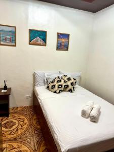 Postel nebo postele na pokoji v ubytování Corazon El Nido Inn
