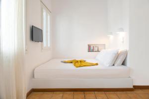 Кровать или кровати в номере Archipelago Sifnos - Seaside Accommodation