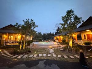 a villa with a swimming pool at night at Villa Taa Koh Samui in Amphoe Koh Samui +12 photos