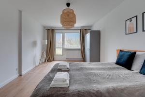 Ένα ή περισσότερα κρεβάτια σε δωμάτιο στο Comfort Apartments Stolarska