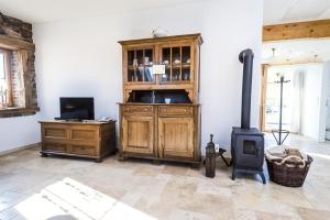 a living room with a wood stove in a room at Hofgut Dösterhof - Ferienwohnungen in Wadern