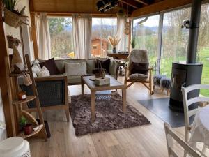 a living room with a couch and a fireplace at Escale sur la Côte in Porrentruy