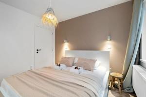 Cama ou camas em um quarto em Alejandro - lovely 2 bedroom apartment in Ostend