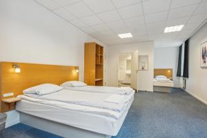Postel nebo postele na pokoji v ubytování BB-Hotel Vejle Park