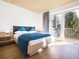 Postel nebo postele na pokoji v ubytování Aldiana Club Hochkönig