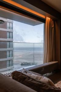 Кровать или кровати в номере Huswell - Cosy apartment with sea view