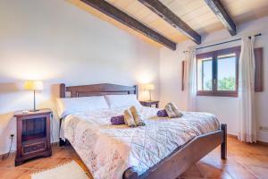 a bedroom with a bed with two pillows on it at Ses Oliveres in Campos +19 photos