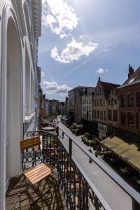 a balcony of a building with a view of a street at Modern apartment in the centre of Antwerp in Antwerp