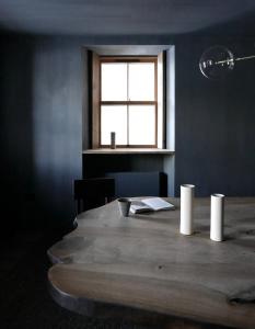 a wooden table in a room with a window at Gairnshiel lodge - Unique & exclusive lodge next to the castle in Ballater