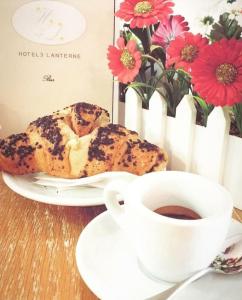 a cup of coffee and a pastry and a cup of coffee at Hotel le 3 lanterne in Marina di Sibari