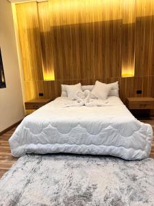 Ένα ή περισσότερα κρεβάτια σε δωμάτιο στο Farida Apartment
