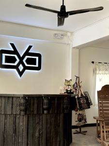 a stage with a black and white sign on it at Sleep Owl Chiang Mai in Chiang Mai