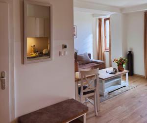 a living room with a table and a couch at Apartmany Fonte in Orechov&aacute; Pot&ocirc;ň