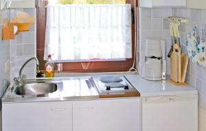 a small kitchen with a sink and a window at Ferienwohnung Altenberg in Bärenstein