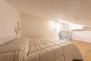 a bedroom with a bed in a white room at Casa Argo Guest House in Bisaccia +36 photos