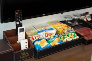 a box filled with snacks and a wii controller at Lam Anh Hotel Bắc Từ Liêm Hà Nội in Hanoi