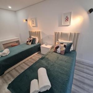 S.Soares T3 Expo Sul tesisinde bir odada yatak veya yataklar